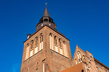 Fototapeta na wymiar Big steeple of a church in guestrow in germany