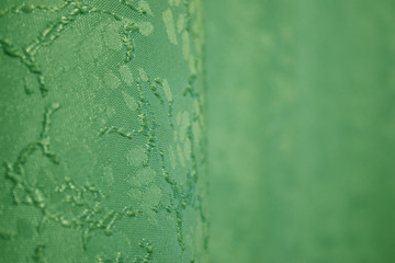 green curtains with a blurred background and pattern