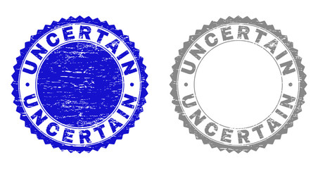 Grunge UNCERTAIN stamp seals isolated on a white background. Rosette seals with grunge texture in blue and gray colors. Vector rubber stamp imprint of UNCERTAIN tag inside round rosette.