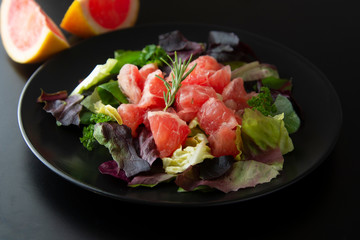 Healthy salad grapefruit and green leaves. Deliciouse dietary food. lose weigh.