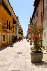 Fototapeta na wymiar People walking in a beautiful Italian village. San Felice Circeo, Lazio, Italy