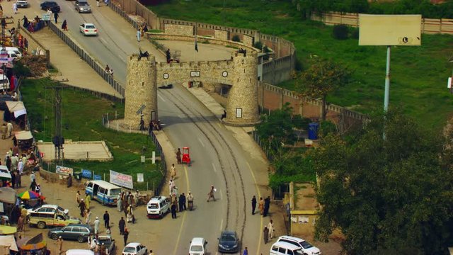 Peshawar, Pakistan, Aerial view of busy mountain pass connecting the Pak-Afghan border through white range with valley of Peshawar