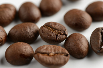 coffee grains on a white background, close-up, coffee roasting