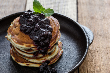 Stack of blueberry pancakes with homemede berry jam,  healthy breakfast