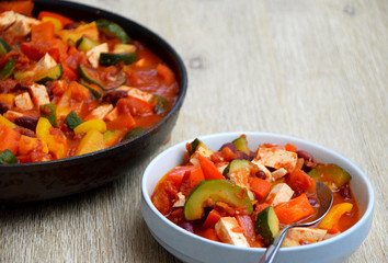 Healthy vegan beans and tofu stew served at the table