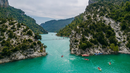Aerial view of the Congost de Mont-rebei gorge and kayakers in Catalonia, Spain - obrazy, fototapety, plakaty