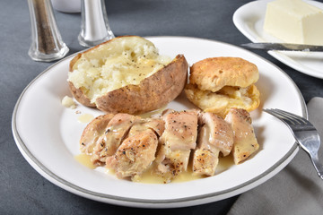 Chicken dinner with baked potato