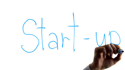 Entrepreneur writing start-up word on white background, business idea, strategy