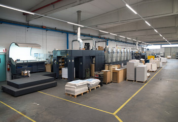 Press printing - Offset machine. Printing technique where the inked image is transferred from a...