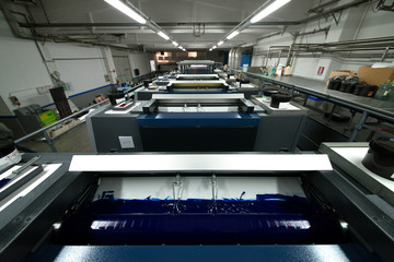 Press printing - Offset machine. Printing technique where the inked image is transferred from a...