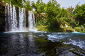 The scenic lush green park surrounds the gorge with Upper Duden Waterfall, the popular tourist place, Antalya, Turkey.