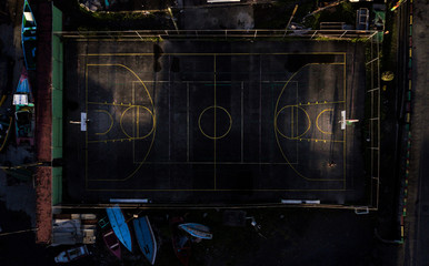in the photo sports ground in grenada, the athlete plays basketball