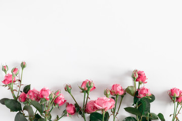 Flowers composition romantic. Pink rose flowers on white background. Valentine's Day, Easter, Birthday, Happy Women's Day, Mother's day. Flat lay, top view, copy space