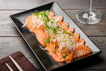 Salmon carpaccio with daikon