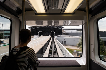 Girl riding train to terminal at Tampa Airport