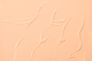 Liquid foundation texture. Make up for women. Top view.