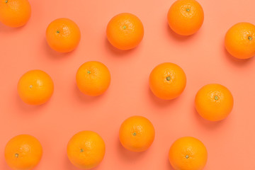 Group of oranges on orange background.