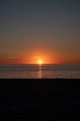 Sunset over calm ocean