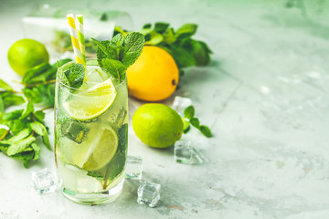 Mojito cocktail with lime and mint in highball glass