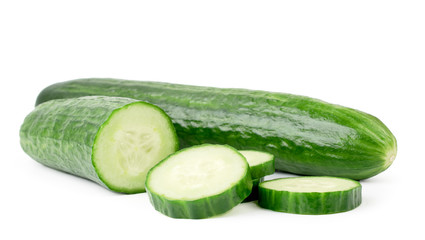 Ripe cucumber and half sliced on a white, isolated.