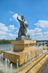 Fototapeta na wymiar The Warsaw Mermaid called Syrenka on the Vistula River bank in Warsaw