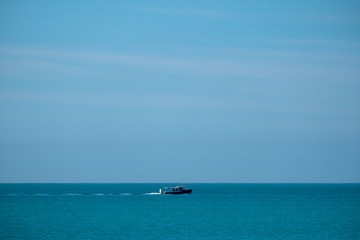 Fototapeta na wymiar Boat out in the Ocean
