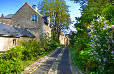Fototapeta na wymiar View on the cozy Chemin de l'Echelle street