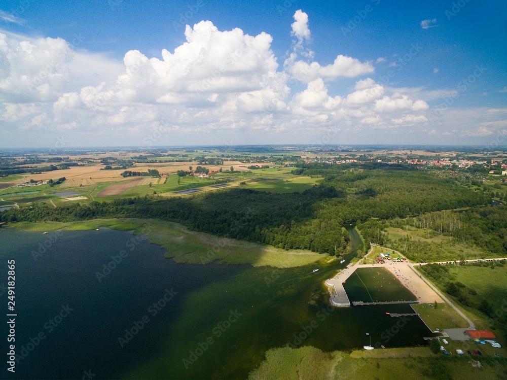 Poster Aerial view of yachts sailing on Mamry Lake, concrete quay and town beach, Wegorzewo, Mazury, Poland