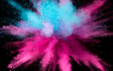 Explosion of colored powder on black background