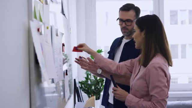 Two ux specialists discussing website, app design