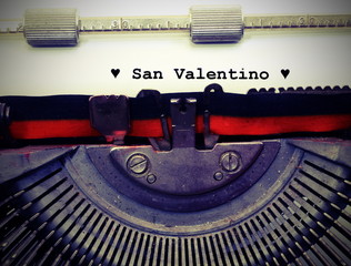 text by typewriter Saint Valentine and black hearts with vintage