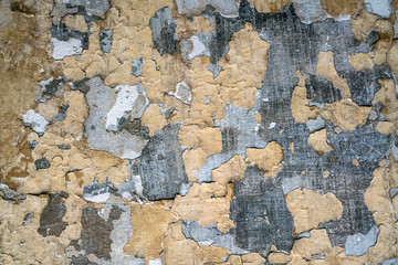 old shabby wall with peeling plaster