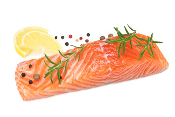 Red fish. Raw salmon fillet with rosemary and lemon isolate on white background.