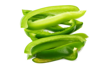 cut slices of green sweet bell pepper isolated on white background top view