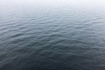 water surface in the fog. small ripples on the water. background