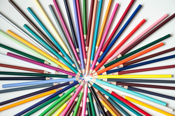 Many multi-colored pencils. Background with color pencils. Rainbow colors, palette. Bright and colorful backgrounds.
