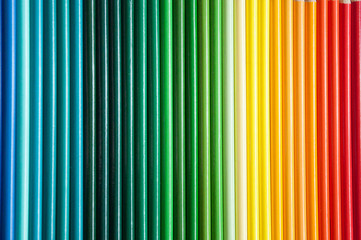 Many multi-colored pencils. Background with color pencils. Rainbow colors, palette. Bright and colorful backgrounds.