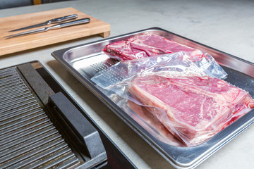 Elevatet view of beef in vacuum plastic bag for sous vide cooking