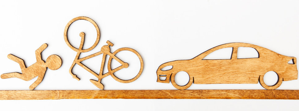 Wooden Toy Little Man And Car And Bicycle On White Background. Concept  Car Accident With Cyclist