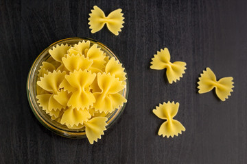 Delicious traditional farfalle Italian macaroni pasta in the glass jar