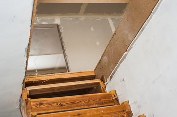 Wooden staircase on the second floor under construction