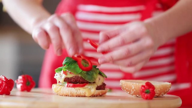 candind view at grilled mear and bun white cooking hamburger at home.