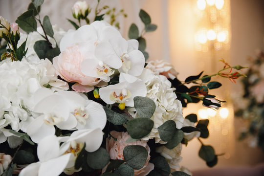 Artificial flowers in bouquet, real sensations, on white background