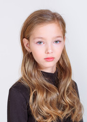 portrait of little model girl in studio