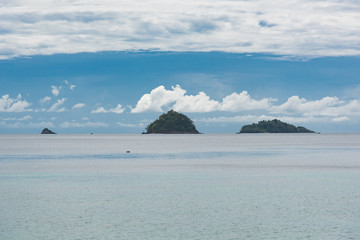 Seascape with small islands and cloudy sky