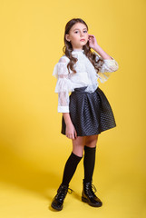 portrait of little model girl in studio