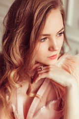 Tender emotional young sexy lady in fashion glamourous lingerie posing . Wedding, bride morning,...