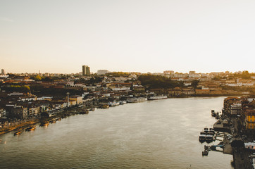 Porto cityscape with red roofs and river while sunset