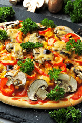 Vegan pizza with vegetables and mushrooms. The concept of healthy food without meat.