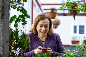 Middle aged woman using smartphone
